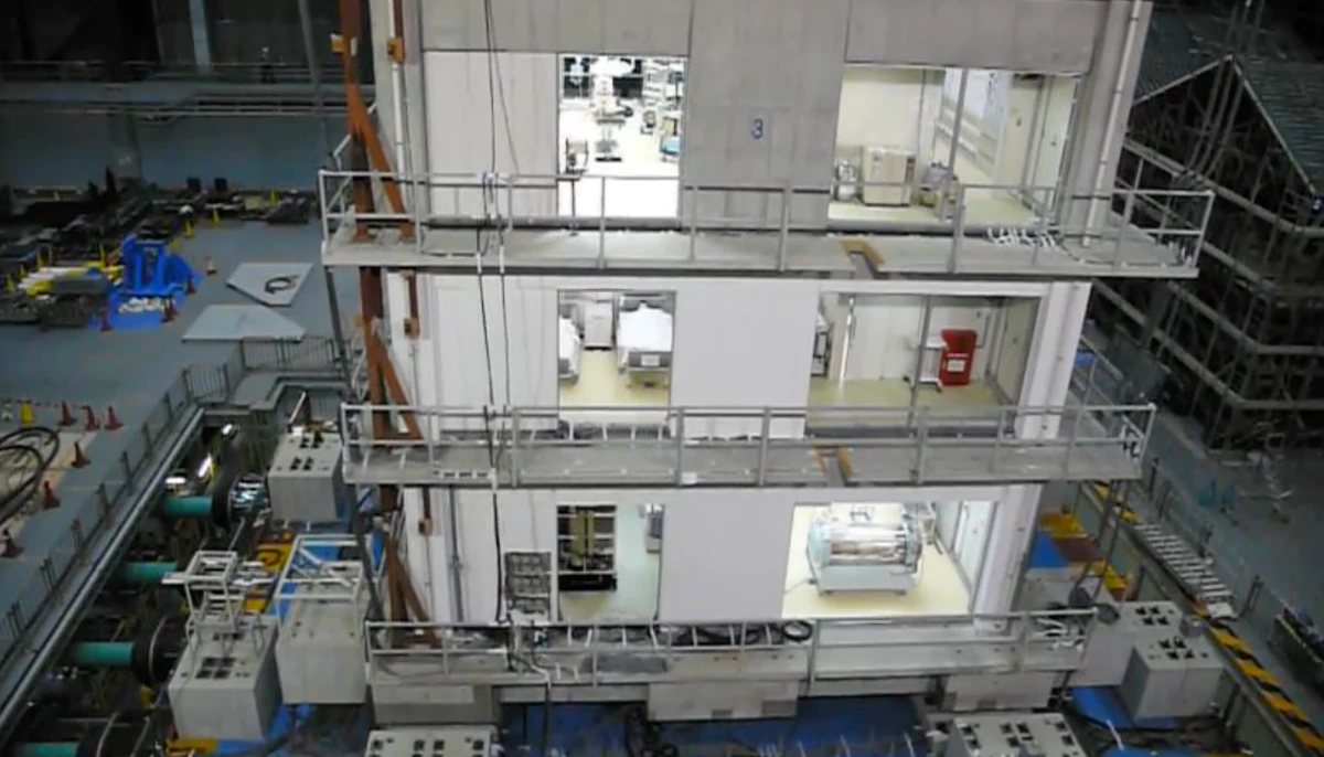The E-Defense shake table with a full-scale multi-storey test building mounted on top